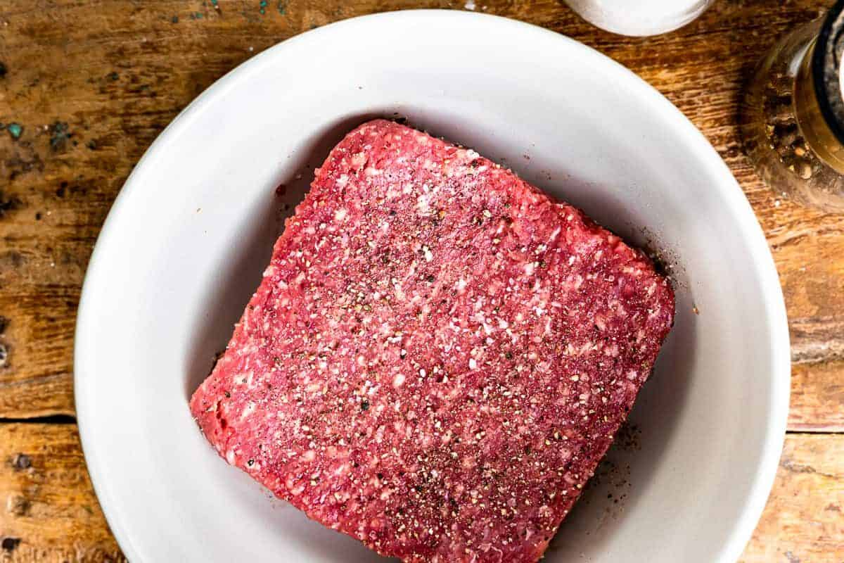 ground chuck in a mixing bowl - how to cook burgers on the stove