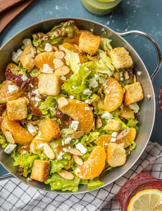 This MANDARIN ORANGE SALAD with ALMONDS AND CIDER VINAIGRETTE has been a favorite in our family forever! SO flavorful and easy. Such a great salad to throw together anytime!