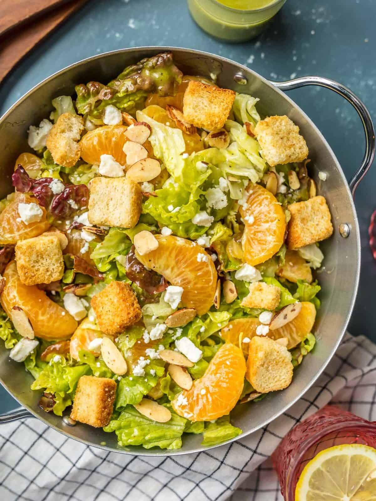 MANDARIN ORANGE SALAD topped with croutons, almonds, feta, and more