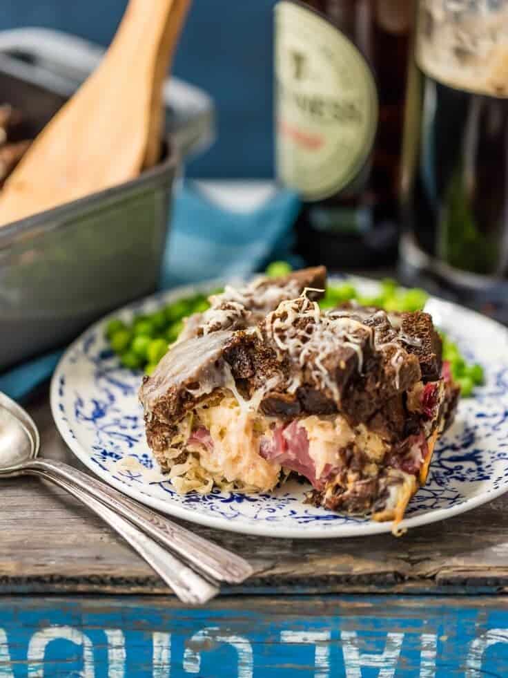 a plate of reuben sandwich casserole on a plate with peas