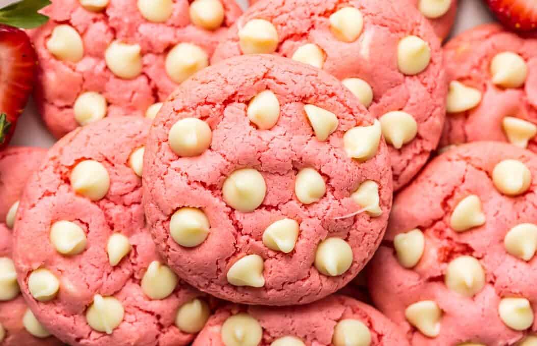 Strawberry Cookies are my favorite Strawberry Cake Mix Cookies! These White Chocolate Strawberry Cake Mix Cookies are so fun and delicious, and so super easy! Fun, festive, and SUPER SIMPLE! Strawberry Cookies with White Chocolate Chips are the perfect Pink Cookies for Valentine's Day, Easter, baby and wedding showers, and beyond! This Cake Mix Cookies Recipe will blow your mind.
