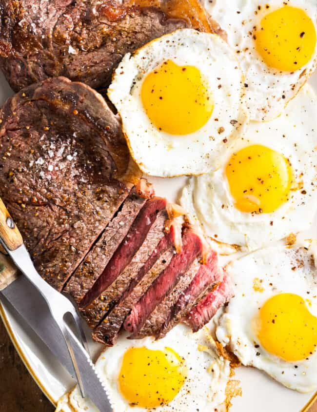 a platter of steak and eggs.