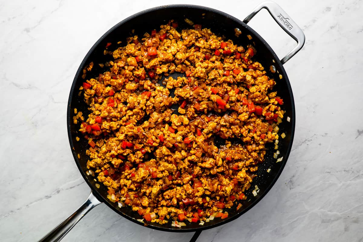 seasoned chicken taco meat in a skillet.