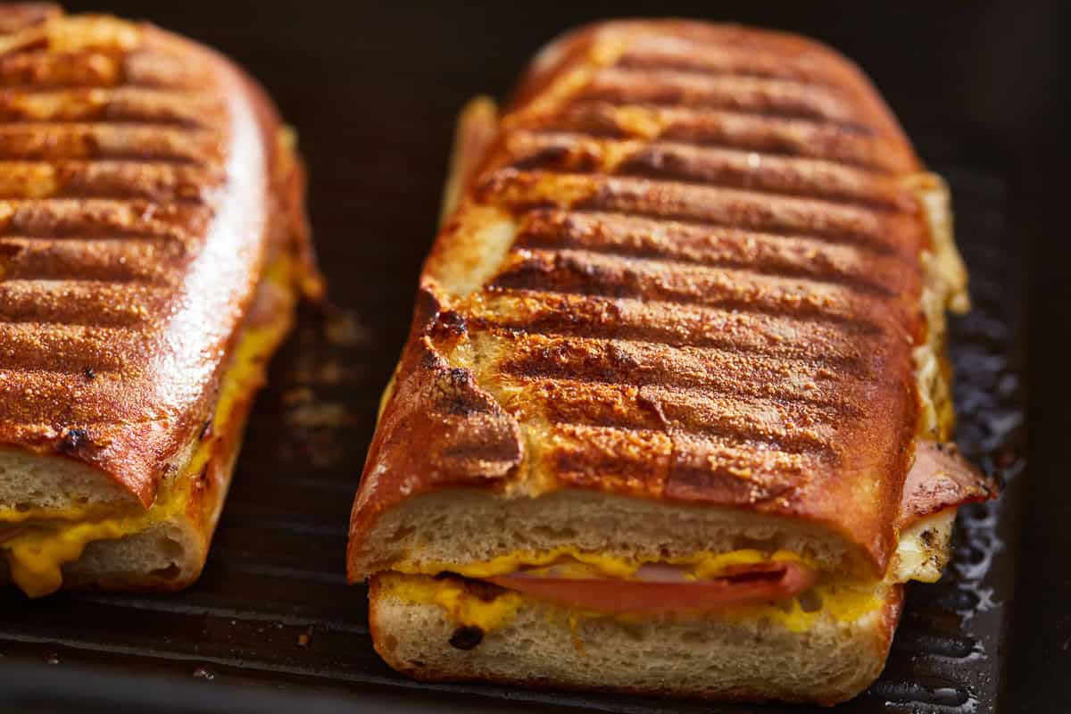 grilling cuban sandwiches in a grill pan.