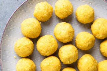 lemon cake balls arranged on a plate.