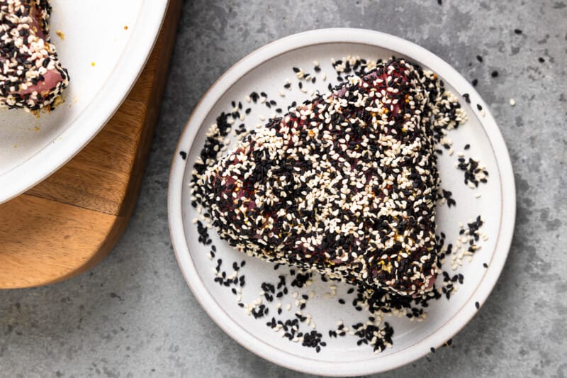 An ahi tuna steak coated in black and white sesame seeds.