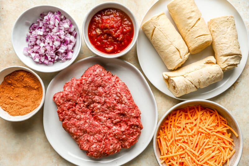 overhead view of ingredients for taco ring on individual plates.