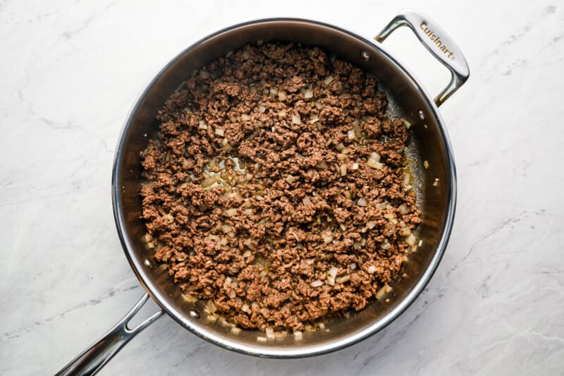cooked ground beef in a stainless pan.