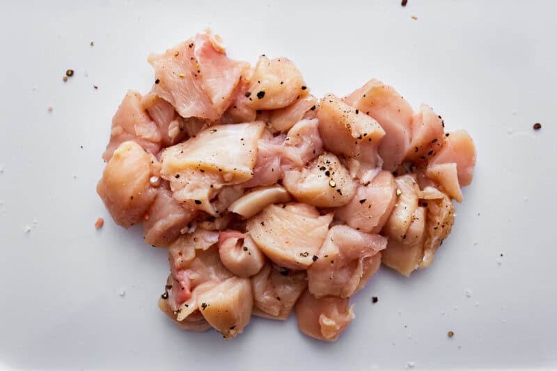 seasoned cubed raw chicken.