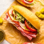 overhead view of an italian sub on parchment paper.