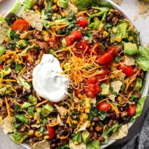 overhead view of taco salad in a bowl with sour cream.