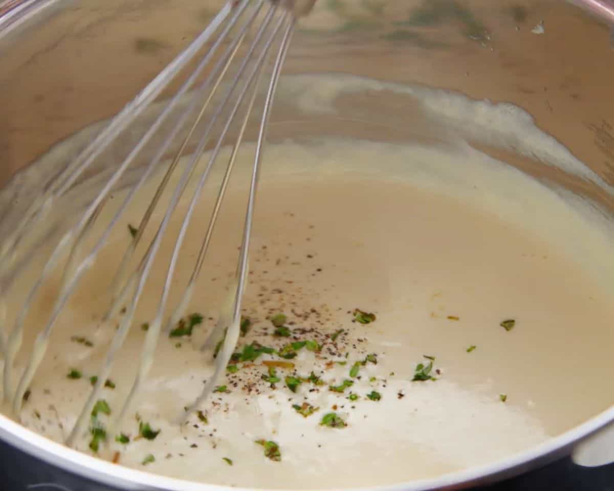 homemade alfredo sauce seasoned with salt and pepper