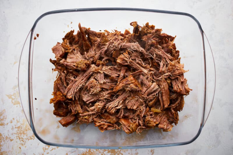 shredded beef in a glass dish.