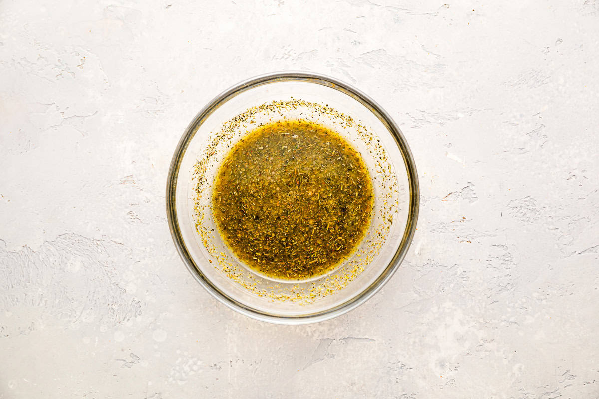 italian seasoned sub dressing in a glass bowl.