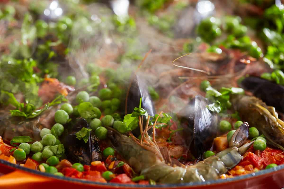 paella simmering in a pan.
