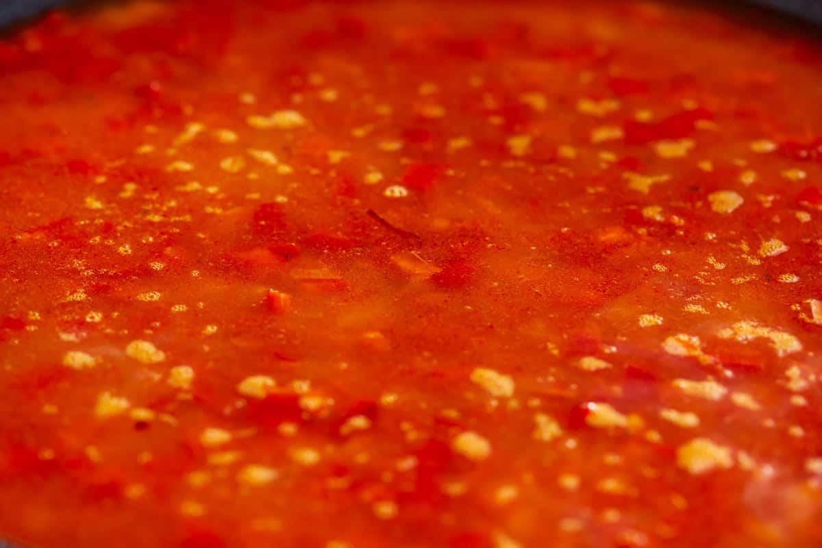 red liquid bubbling in a pan.