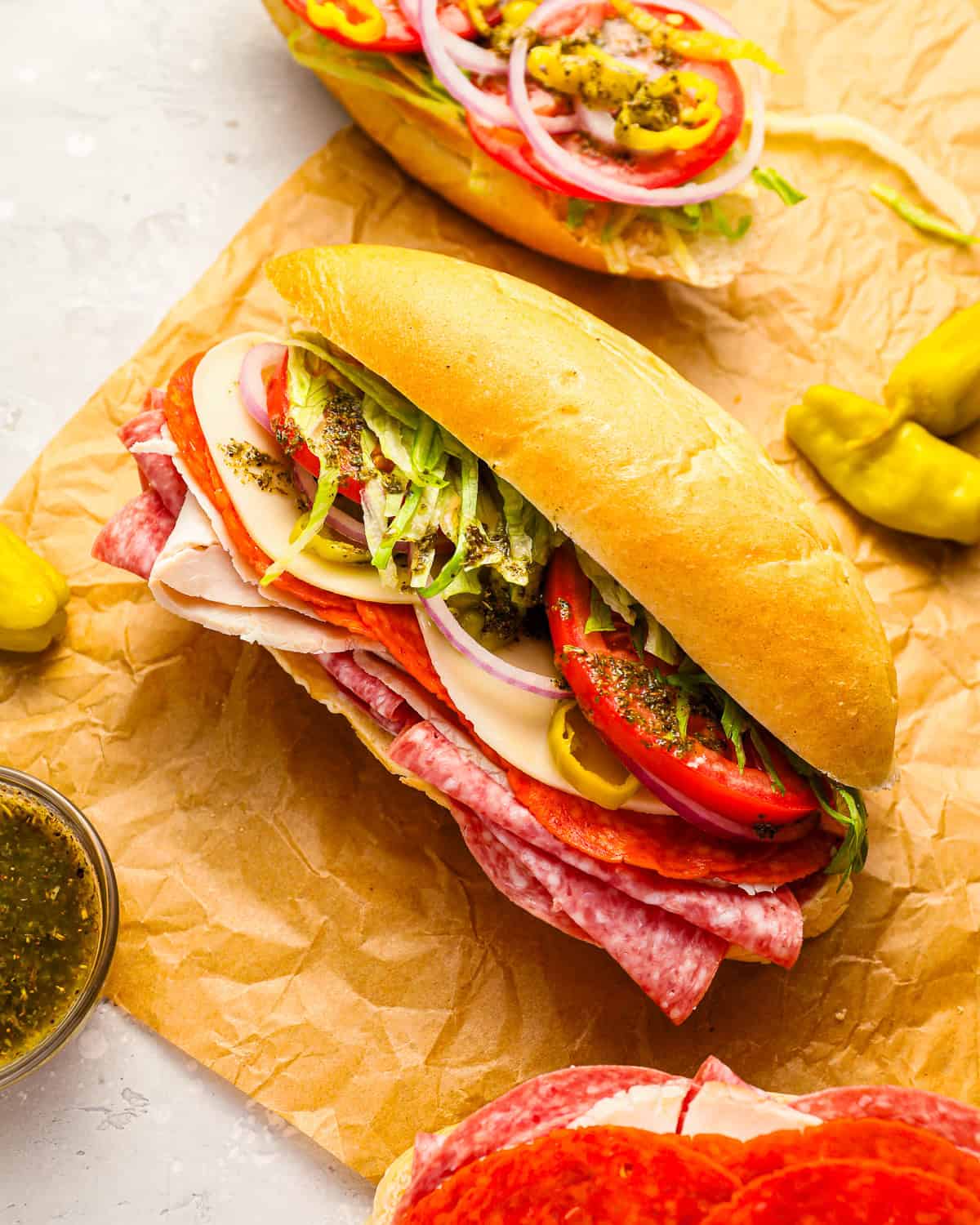 overhead view of an italian sub on parchment paper.