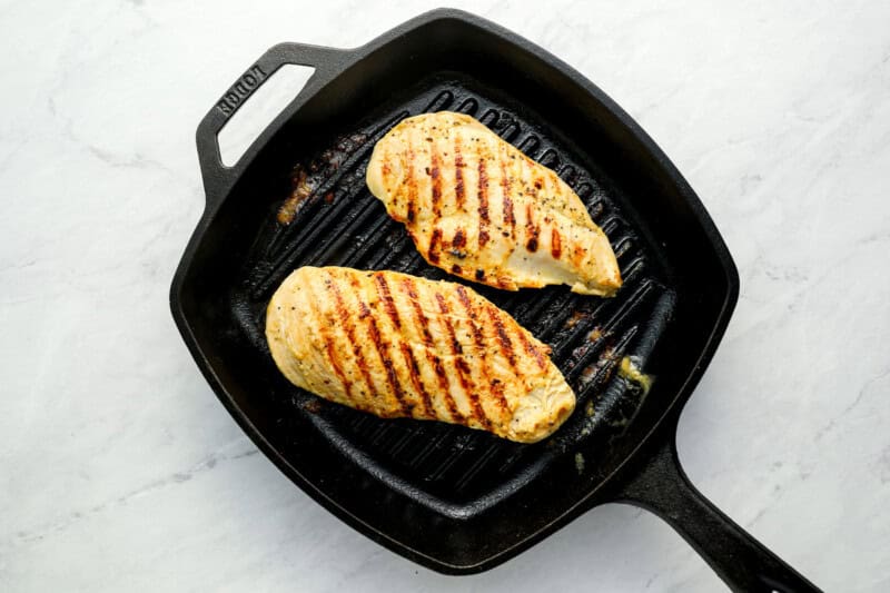 grilled chicken breasts in a grill pan.