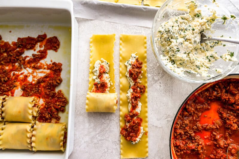 filling and rolling lasagna noodles.