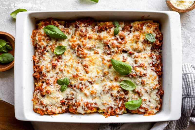baked lasagna roll ups in a baking dish.