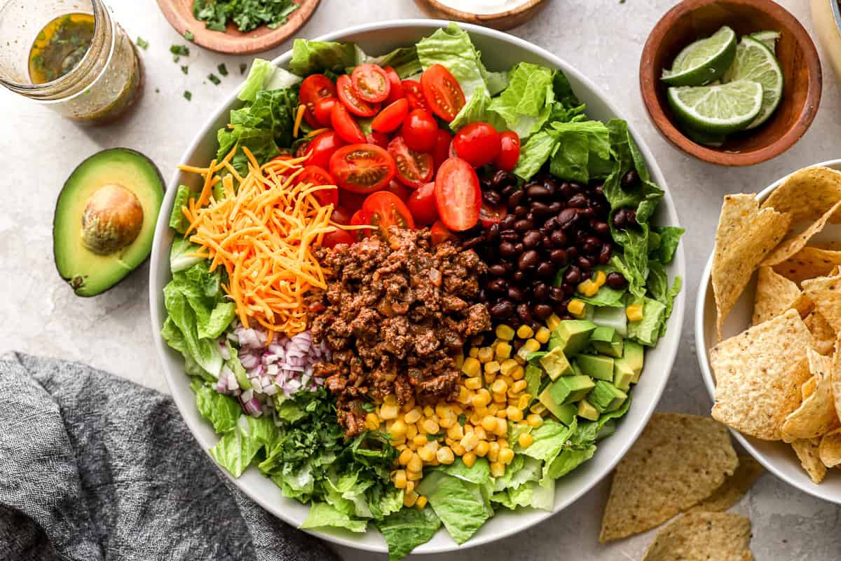 overhead view of deconstructed taco salad in a bowl.