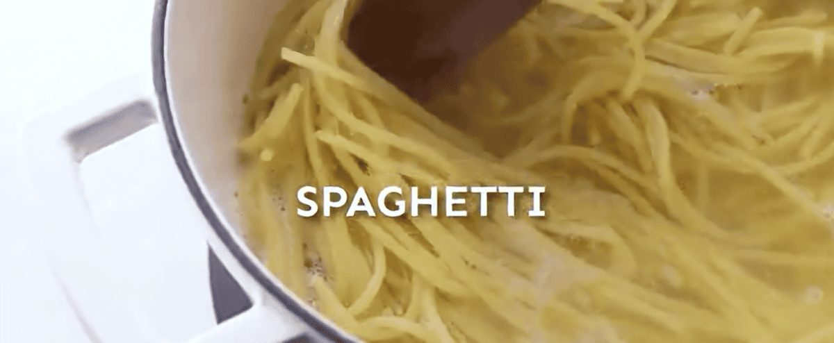 Spaghetti cooking in a pot. 