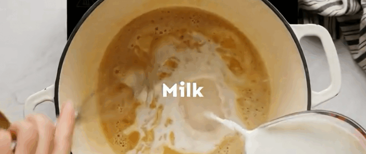 Adding milk and cream to the pot.