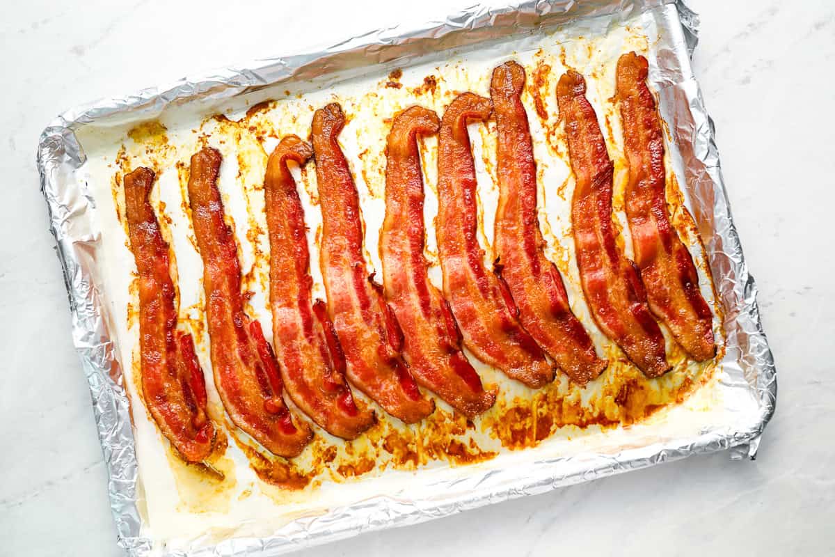oven cooked bacon on a foil lined baking sheet.