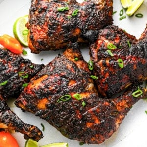 jerk chicken topped with scallions.