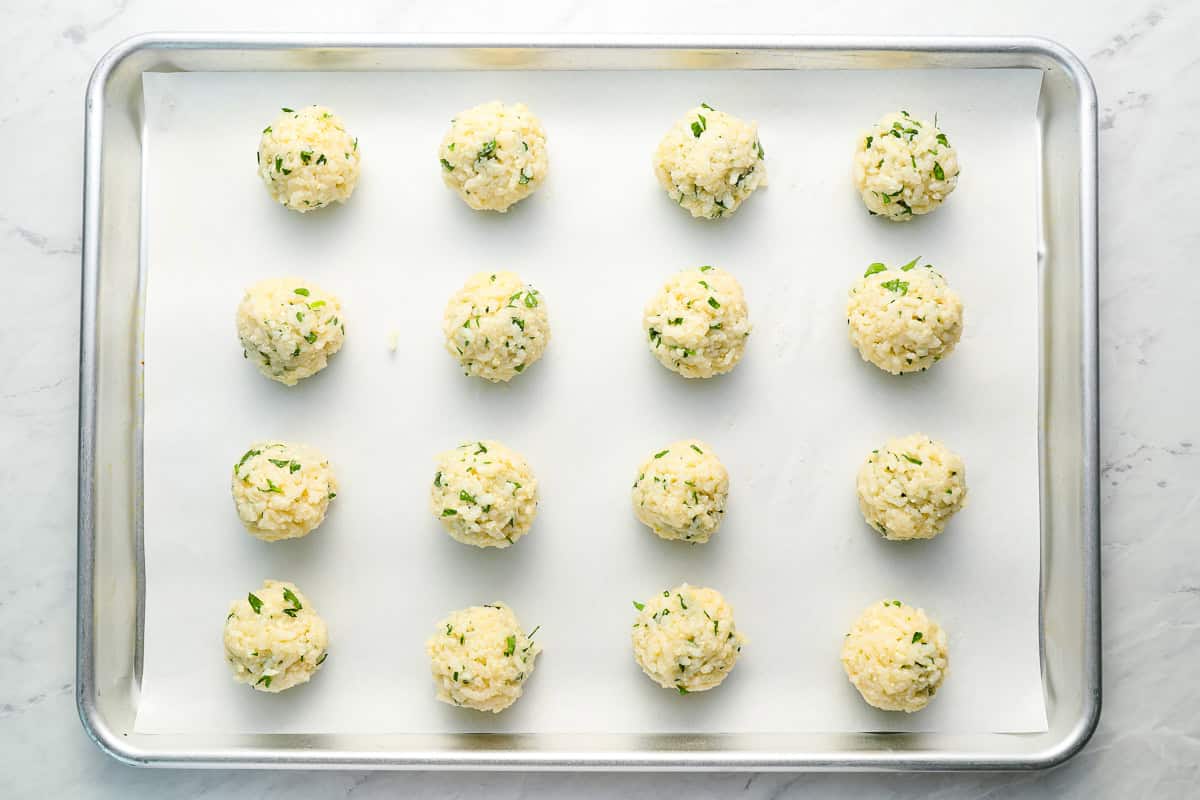 rice balls on a baking sheet.