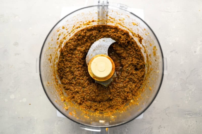 spices blended with onions and peppers in a food processor.