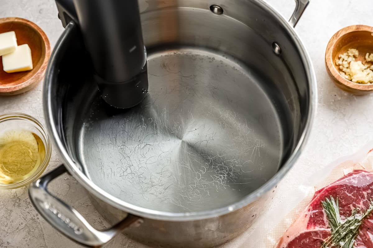 large stock pot filled with water with sous vide machine attached