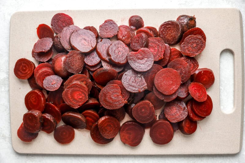 sliced beets on a cutting board.