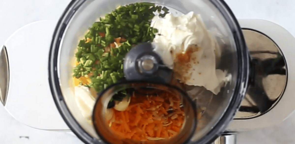Cheese ball ingredients in a food processor.
