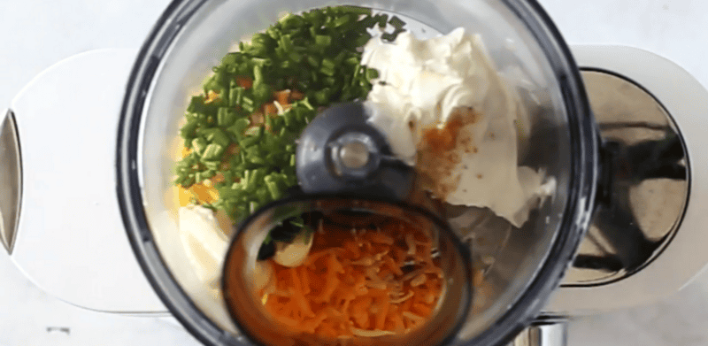 Cheese ball ingredients in a food processor.