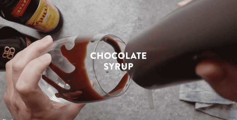 chocolate syrup in a glass