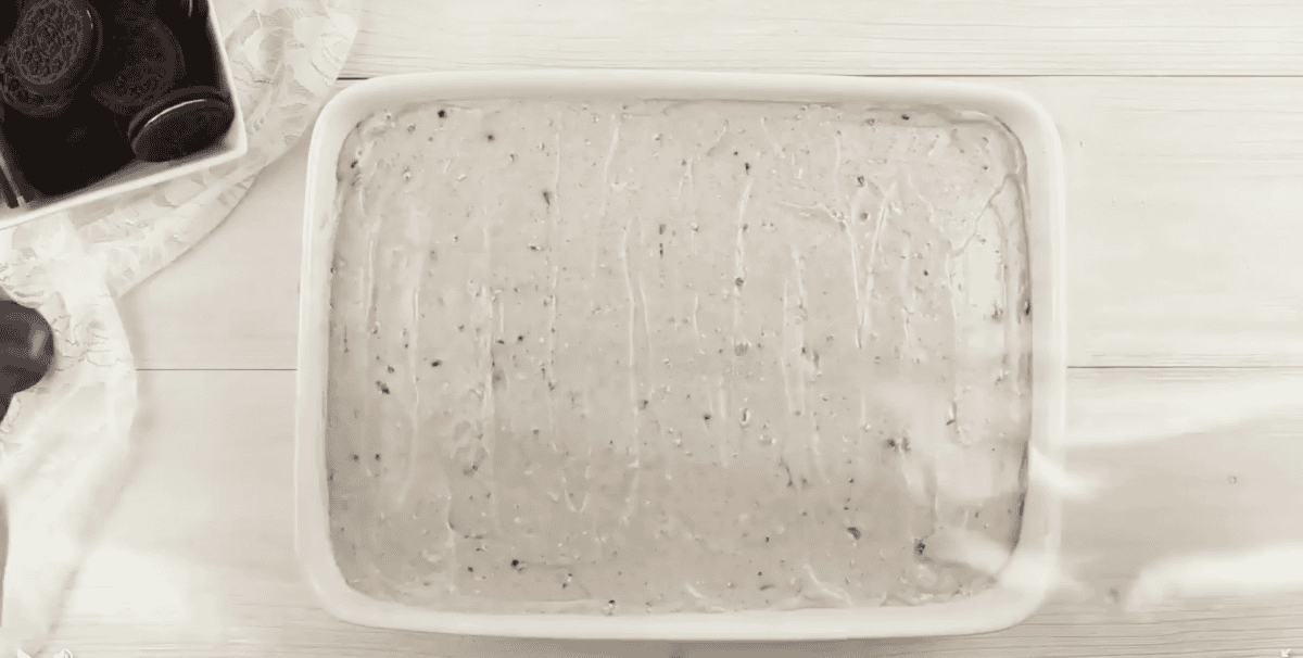 Pudding poured over the poke cake.