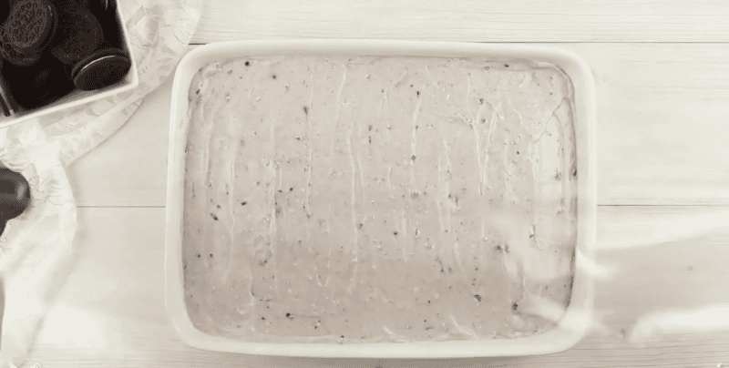 Pudding poured over the poke cake.