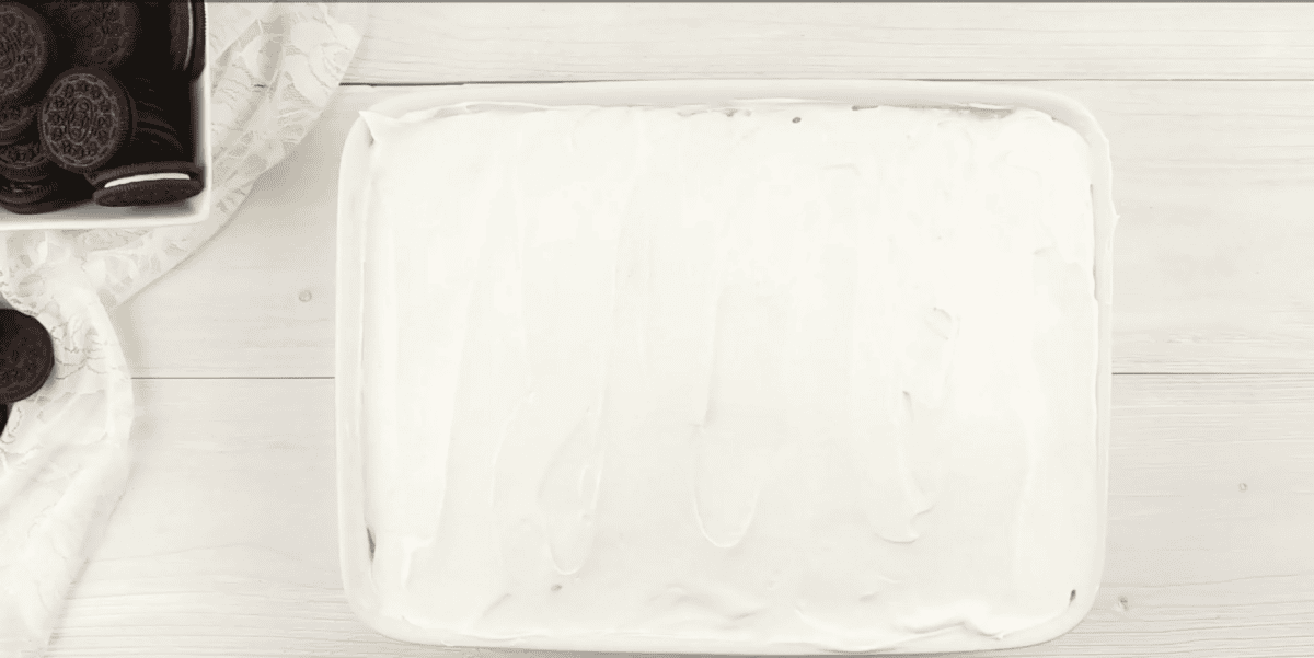 Whipped topping on poke cake. 