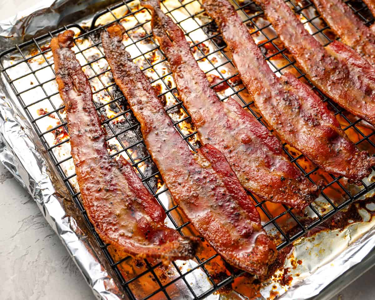 Close-up of freshly baked candied bacon cooling on the rack.