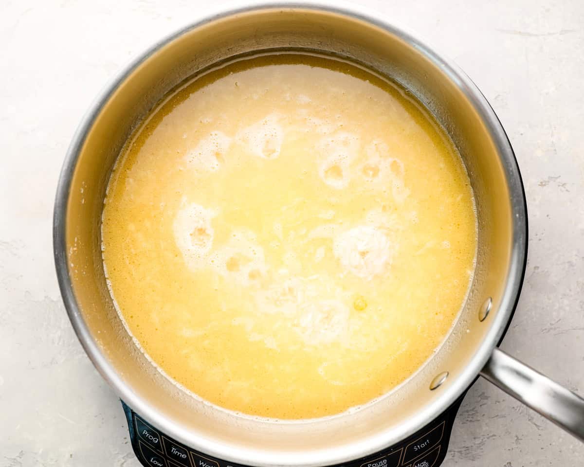 Garlic rice, simmering in chicken broth.