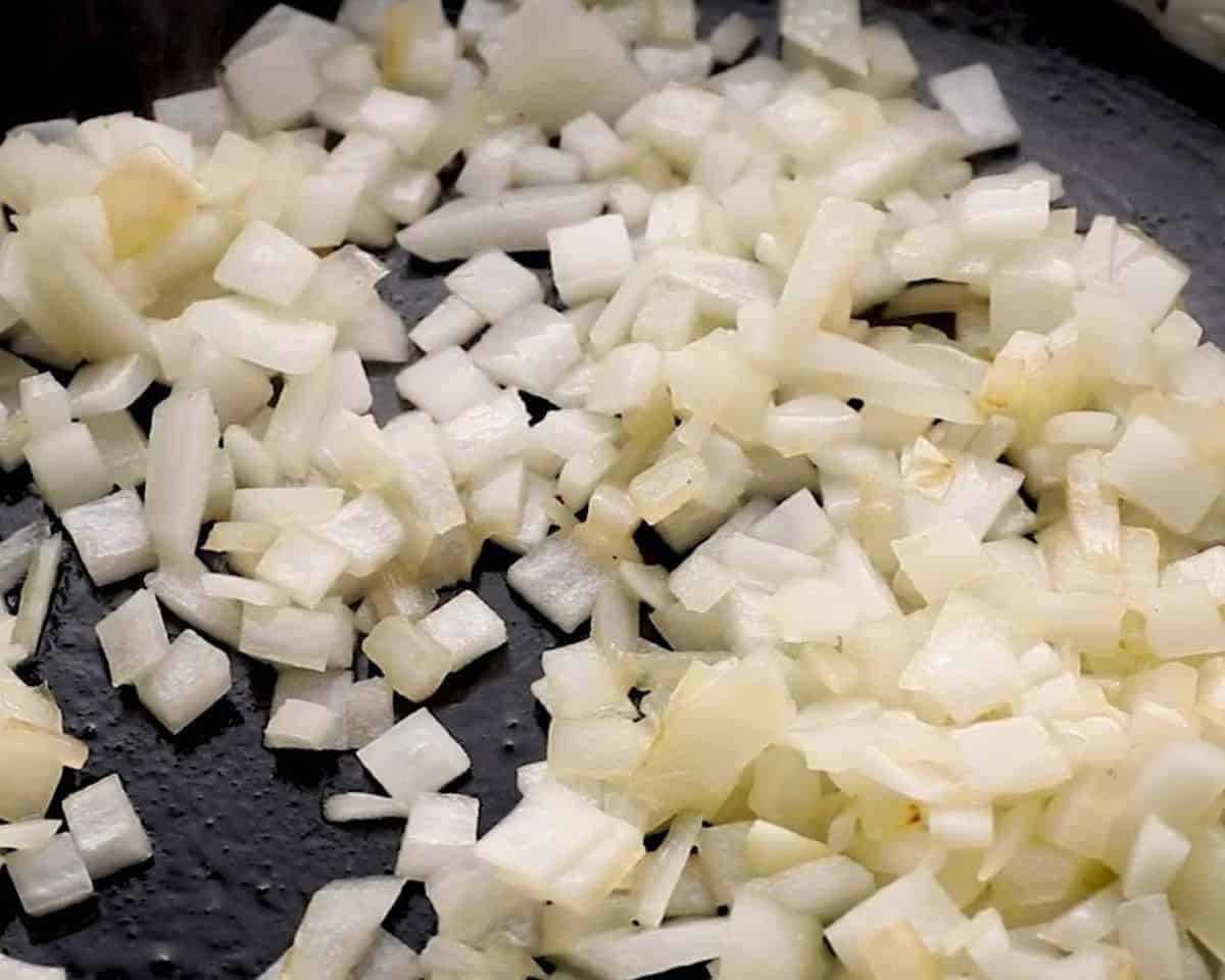 Onions cooking in a skillet. 