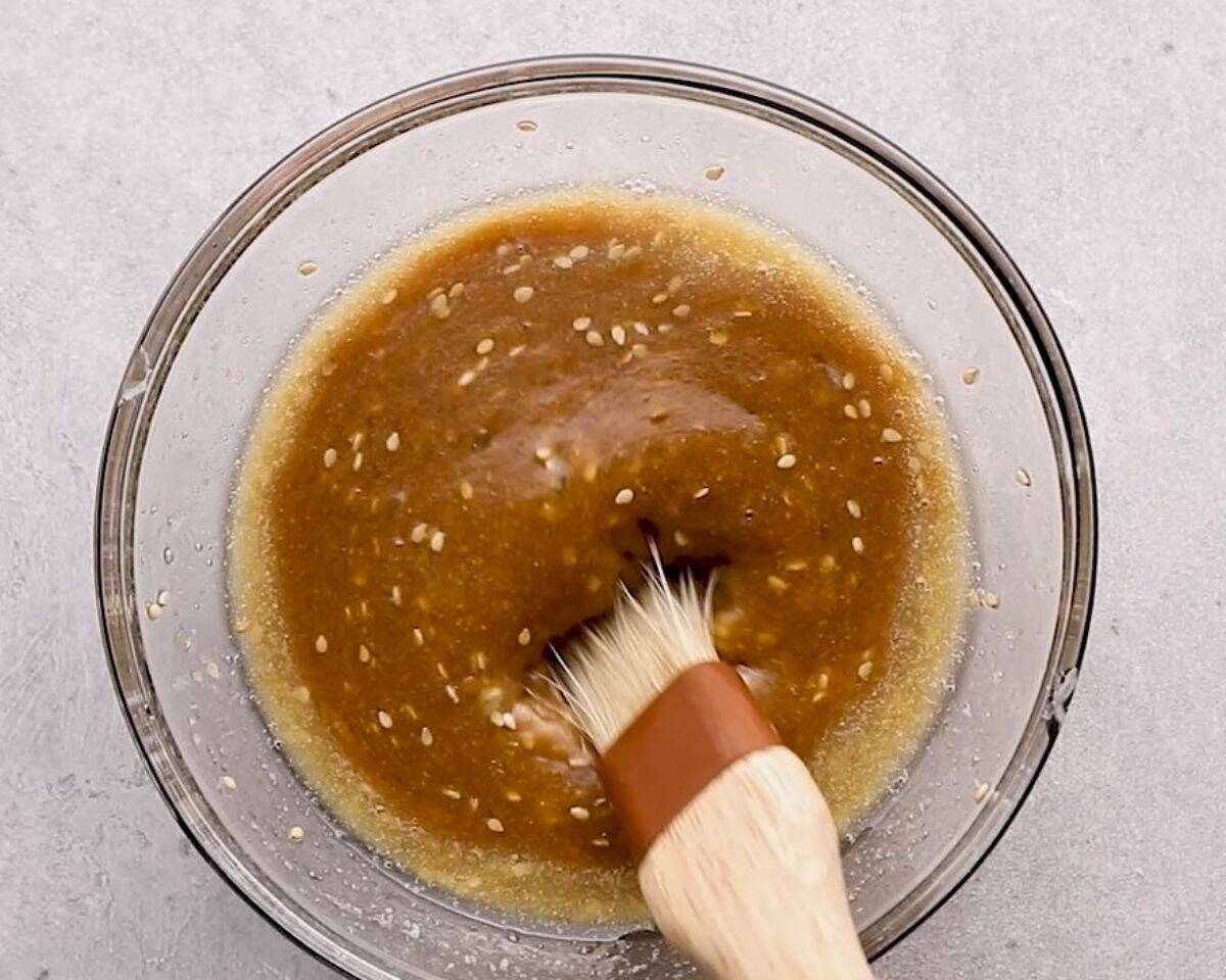 Slider sauce in a bowl with a brush. 