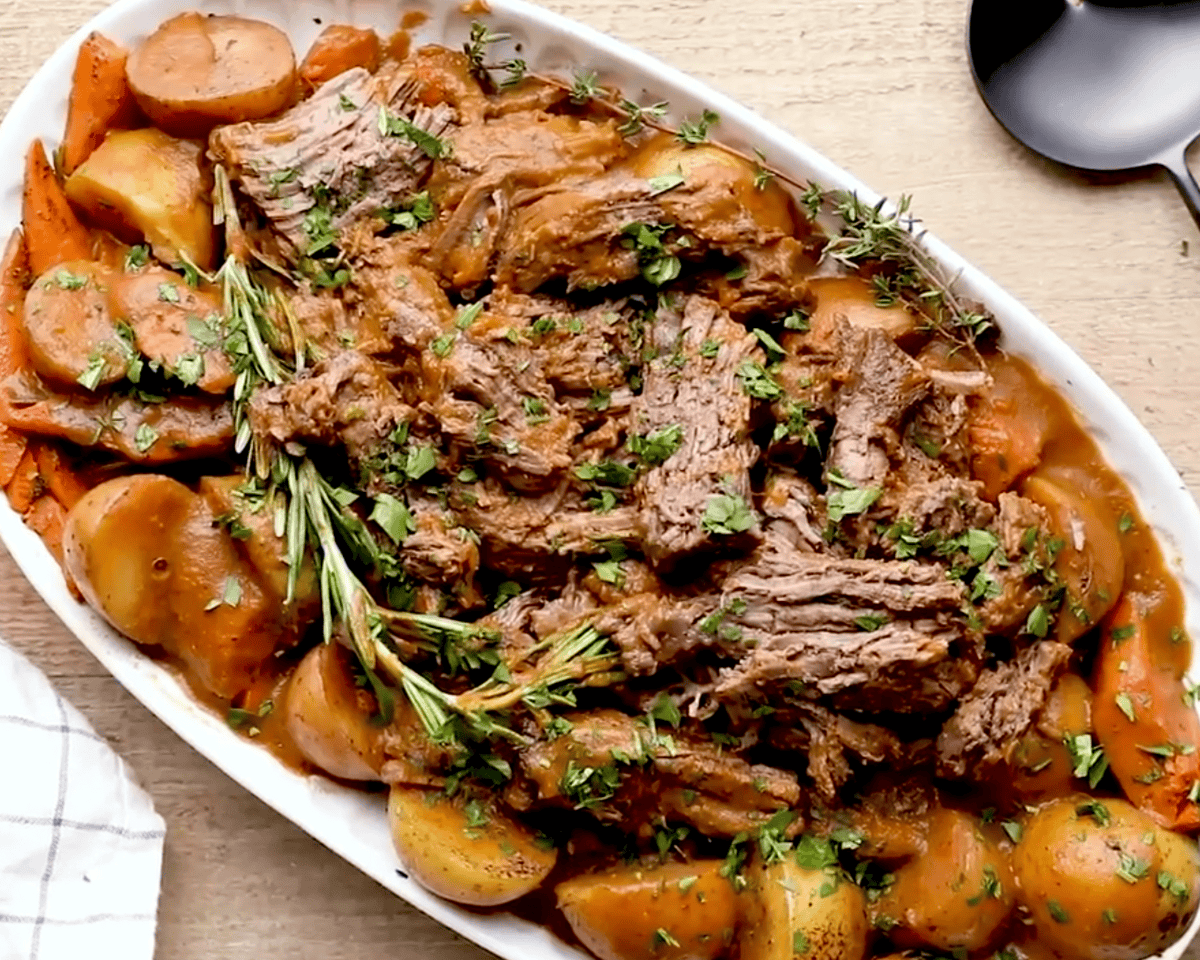 platter of pot roast and vegetables ready to be served