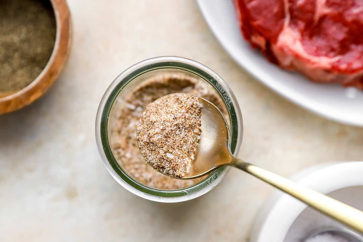 steak seasoning blended and being lifted out if the jar with a spoon