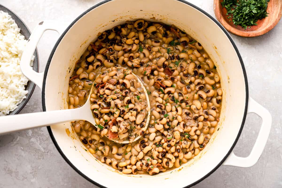 ladle taking out a scoop of black eyes peas