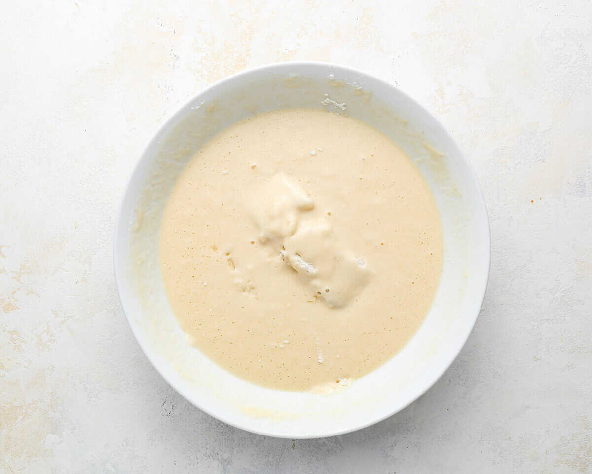 Cod pieces coated in beer batter, ready to fry.