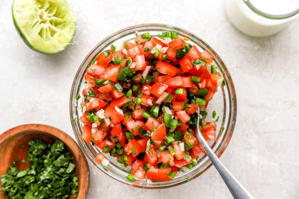 Fresh pico de gallo made with diced tomatoes, jalapeños, onion, cilantro, and lime juice