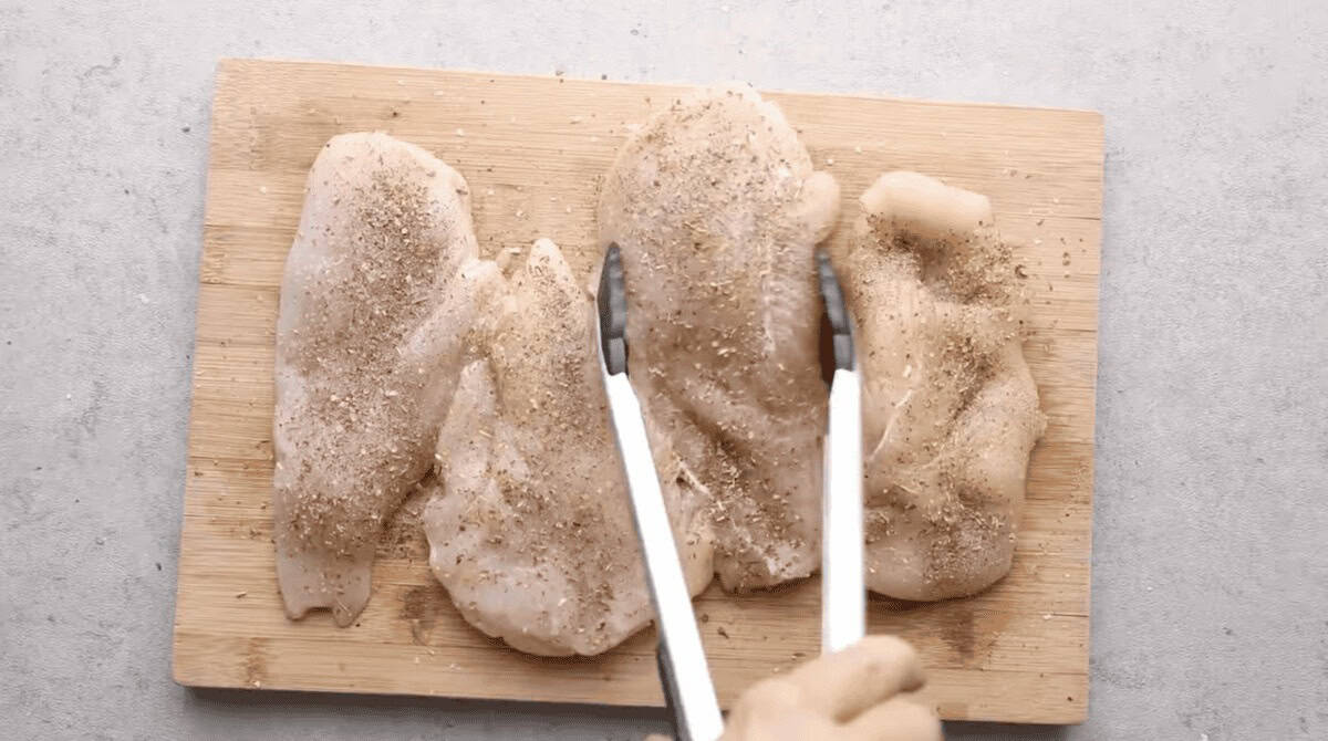 chicken seasoned on a cutting board