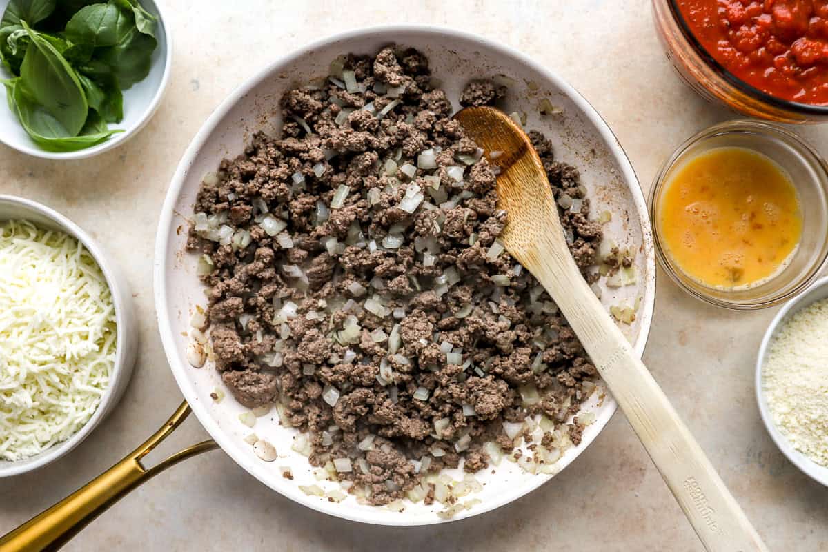 ground beef, onion, and garlic being cooked together